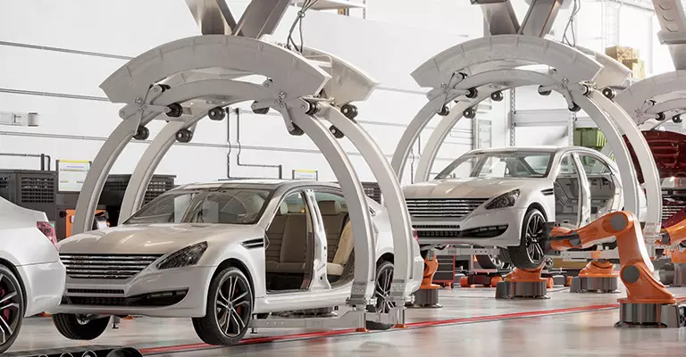 Cars are being assembled in a factory